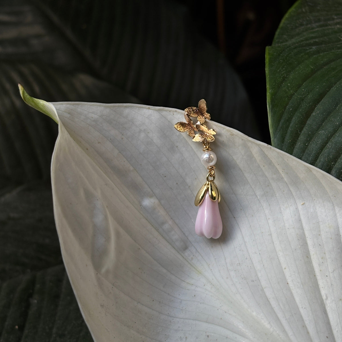 Handcrafted Ceramic Magnolia Bud Earrings with Emerald Accents