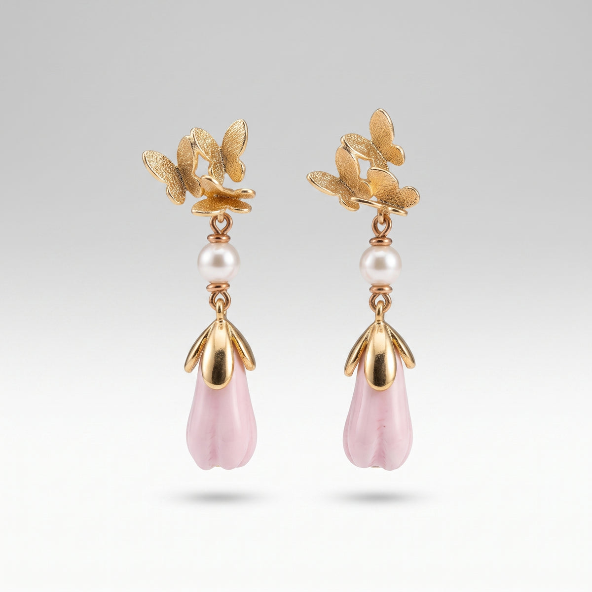 Handcrafted Ceramic Magnolia Bud Earrings with Emerald Accents